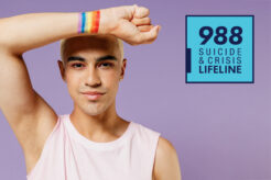 LGBTQ+ person with 988 suicide and crisis lifeline logo